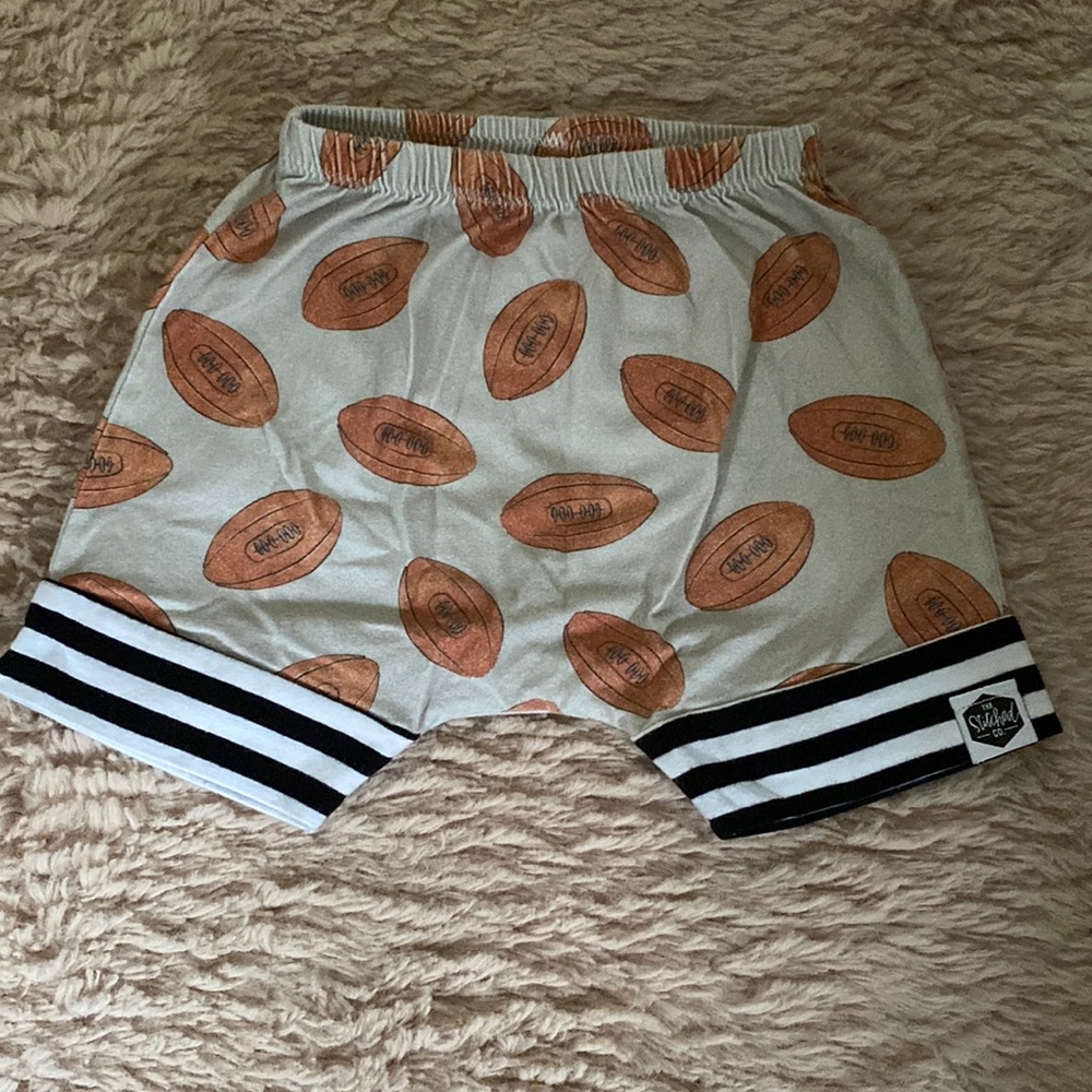 The stitched co football shorts